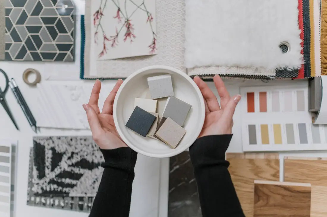 Hands holding finish samples